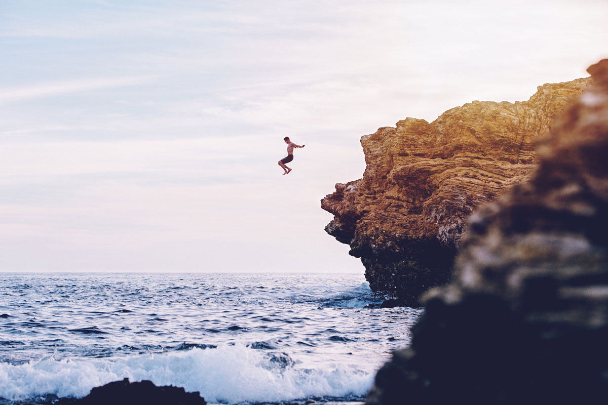 Man diving into ocean