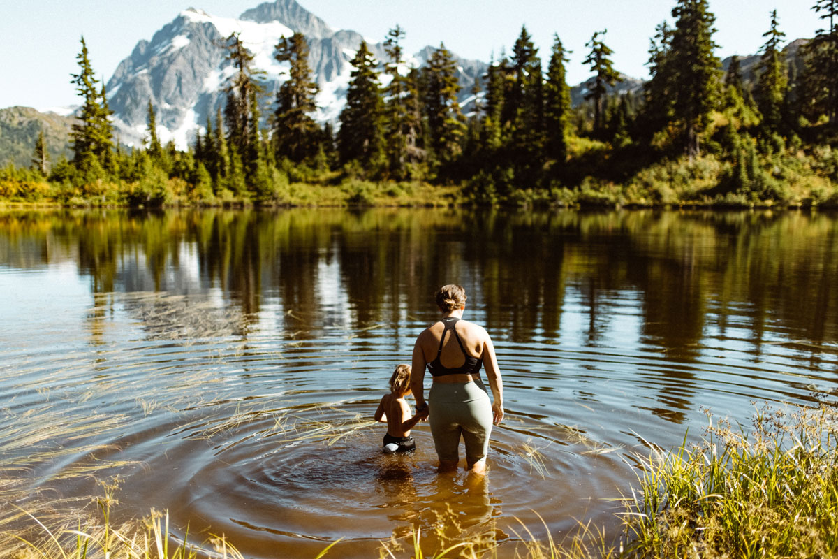 Woman in lake with child