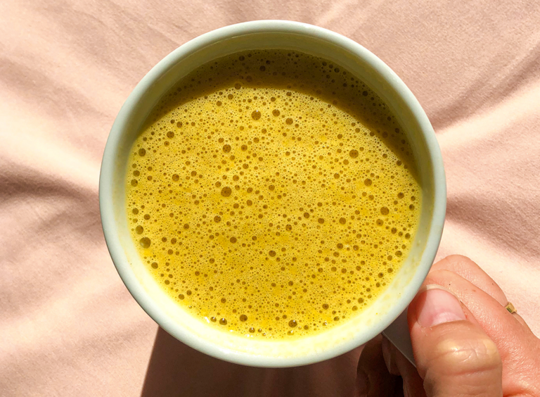 Warm and frothy Gut Healthy Pumpkin Spice Coffee in a white mug